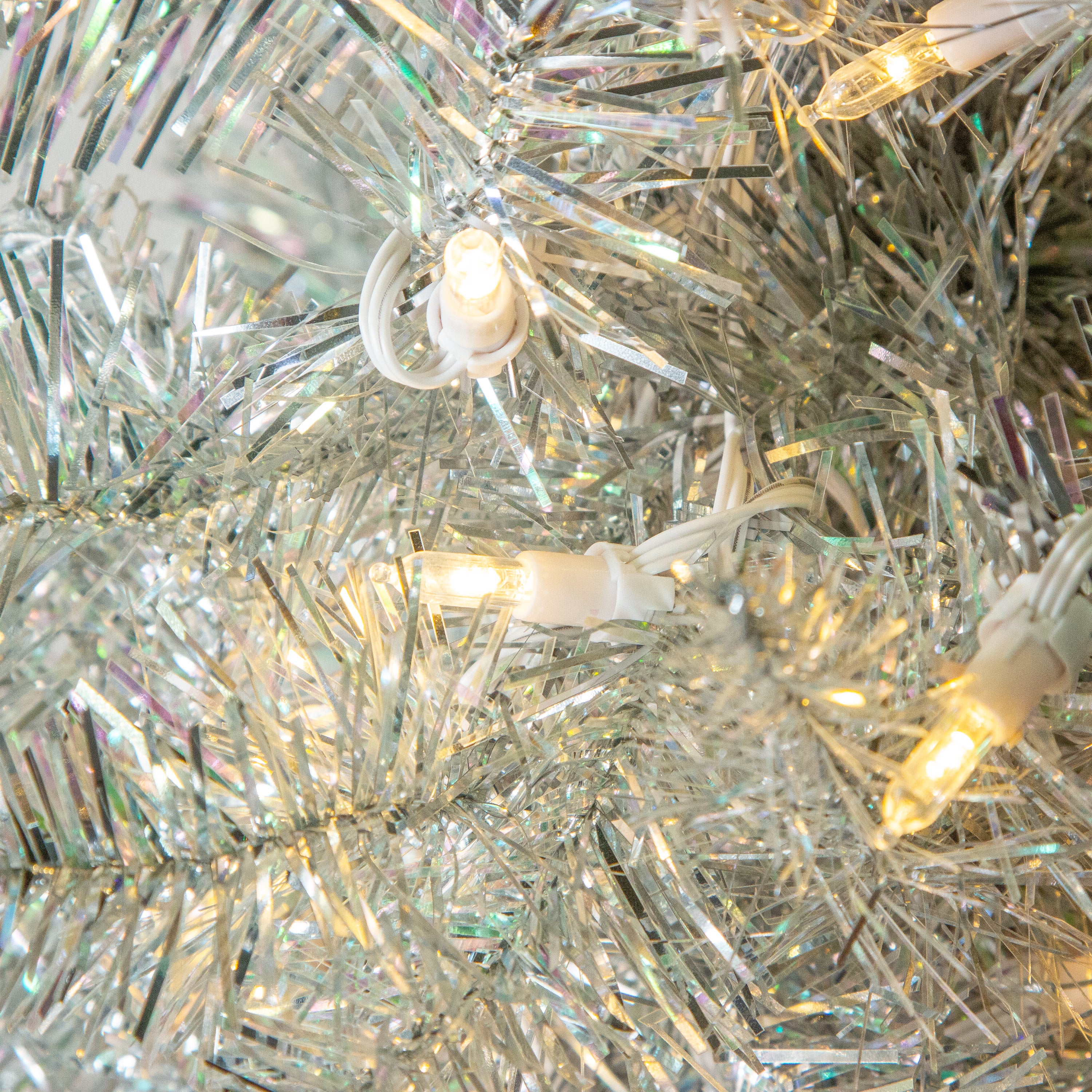 Sterling Elegant 5 Foot Slim Silver Tinsel Tree with Warm White LED Lights